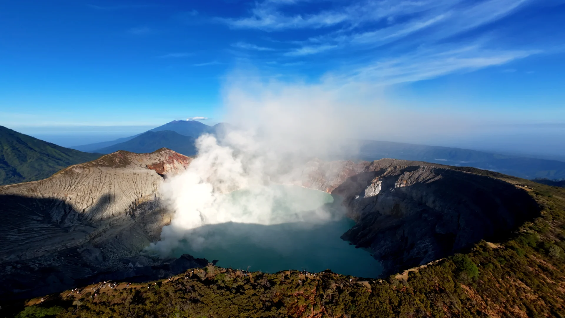 ijen crater photography tips for landscape enthusiasts - Blue Fire - Close up of electric blue flames dancing on volcanic rocks at night