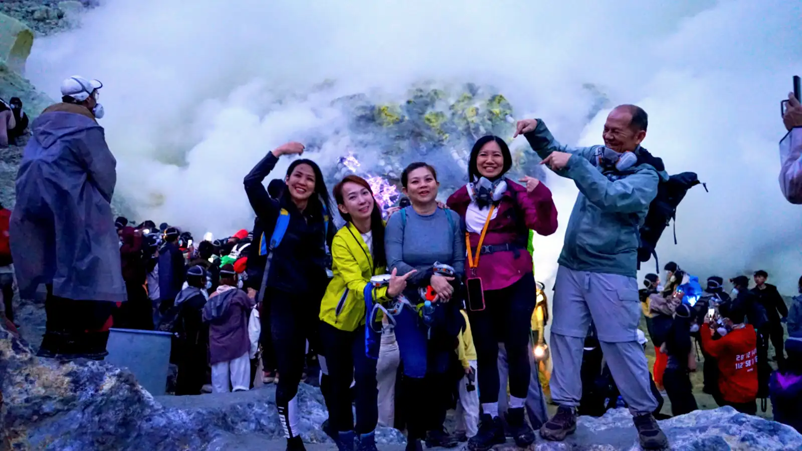 Hikers ascending the steep path of Ijen Crater during the early morning