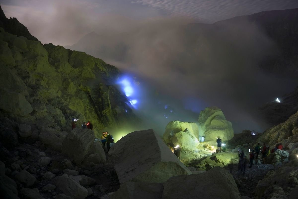 Night hiking at Ijen Crater with headlamps under the stars