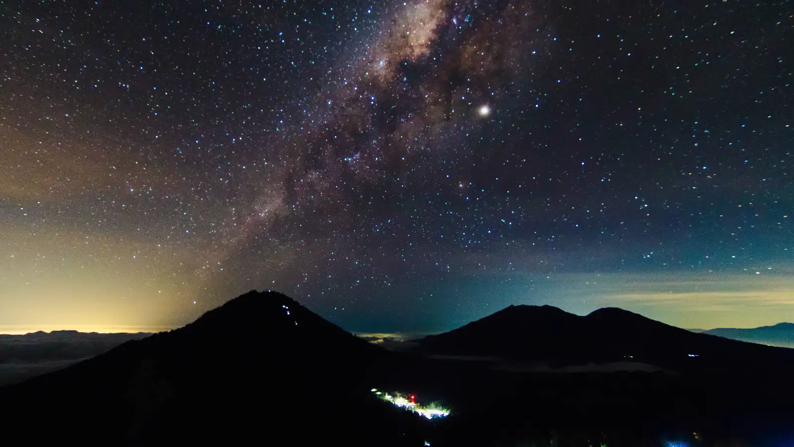 Milky Way over Ijen Crater with teal and orange volcanic hues