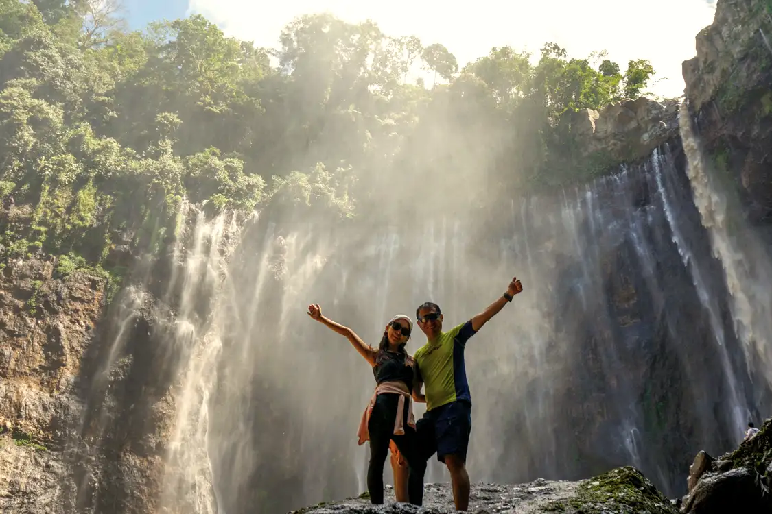 Panoramic view of Tumpak Sewu Waterfall with Mount Semeru in the background