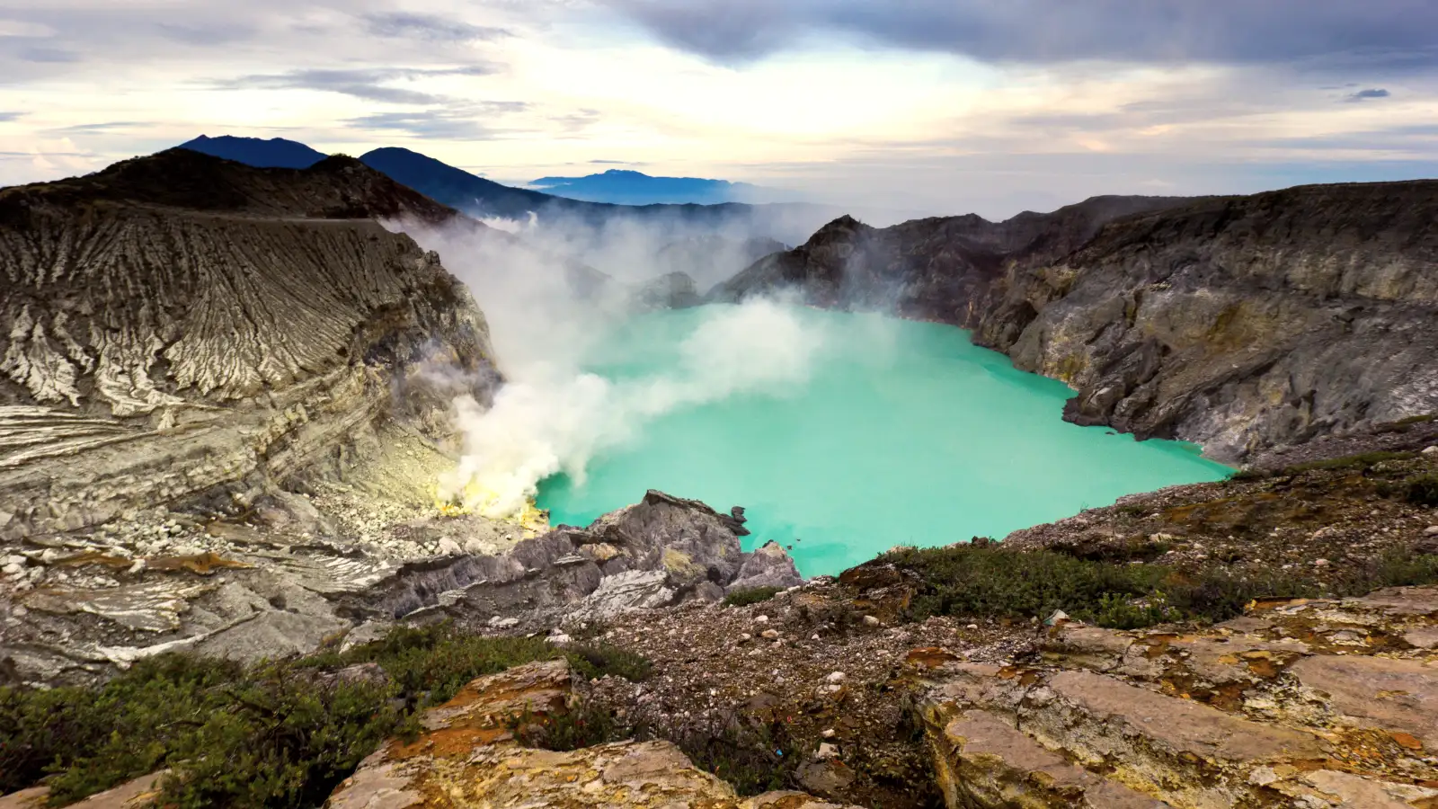 The vibrant turquoise waters of Kawah Ijen Turquoise acidic lake of Kawah Ijen crater in East Java
