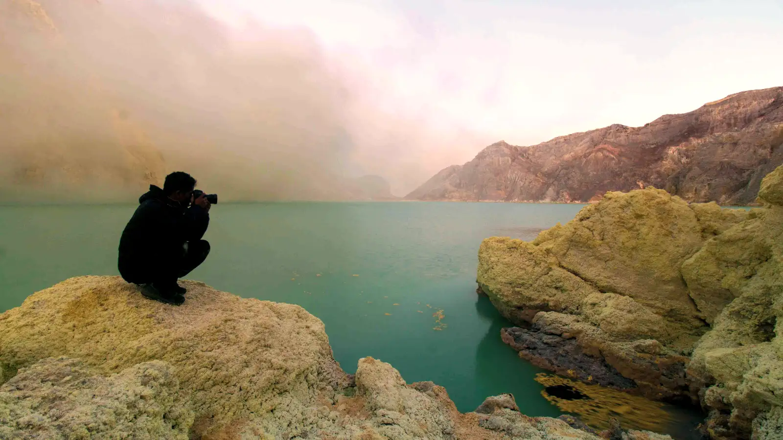 Ijen Crater Turquoise Lake Sunrise View The turquoise acidic lake of Ijen Crater during sunrise