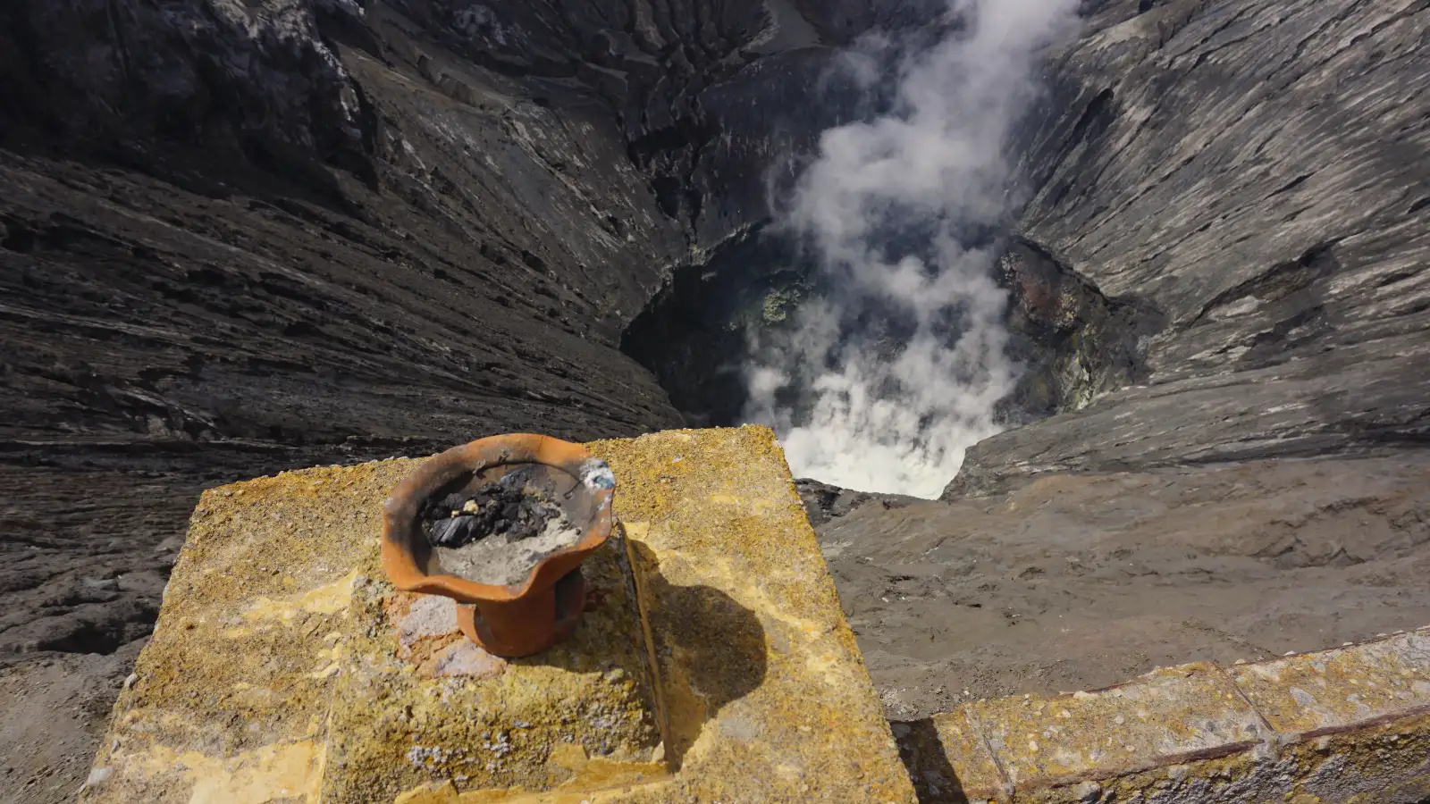 Travelers hiking the stairs to the Mount Bromo crater rim