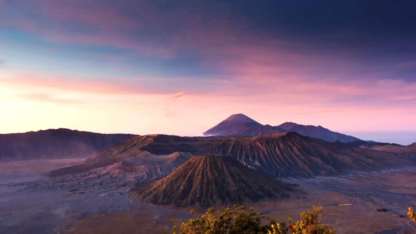 Sunrise view from King Kong Hill Bromo showing Mount Batok and Mount Semeru with clouds