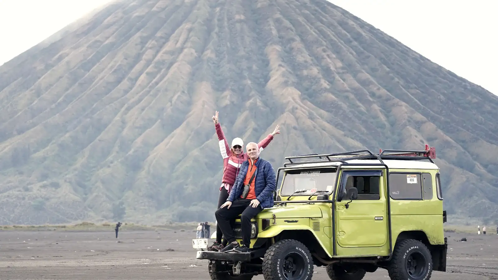 Panoramic view of the Bromo caldera with Mount Semeru erupting in the background