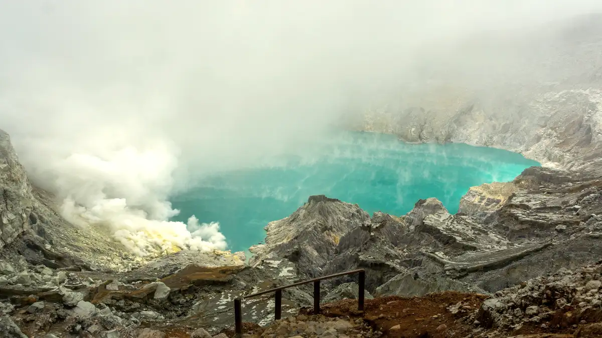 The glowing blue fire and sulfur smoke at the bottom of Ijen Crater