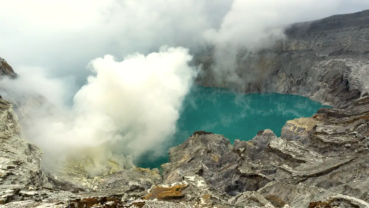 The turquoise acidic lake of Ijen Crater inside the Mount Ijen volcanic complex