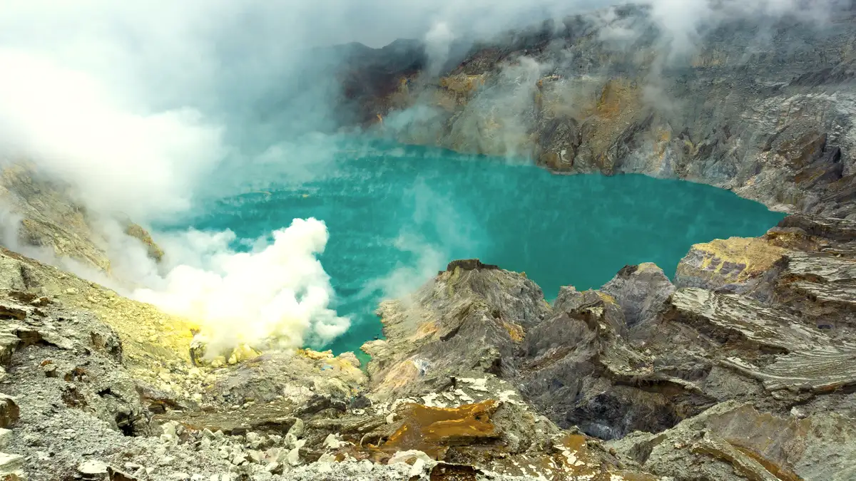 Ijen Crater Turquoise Lake Sunrise View Stunning view of the turquoise acid lake at Ijen Crater during sunrise in East Java