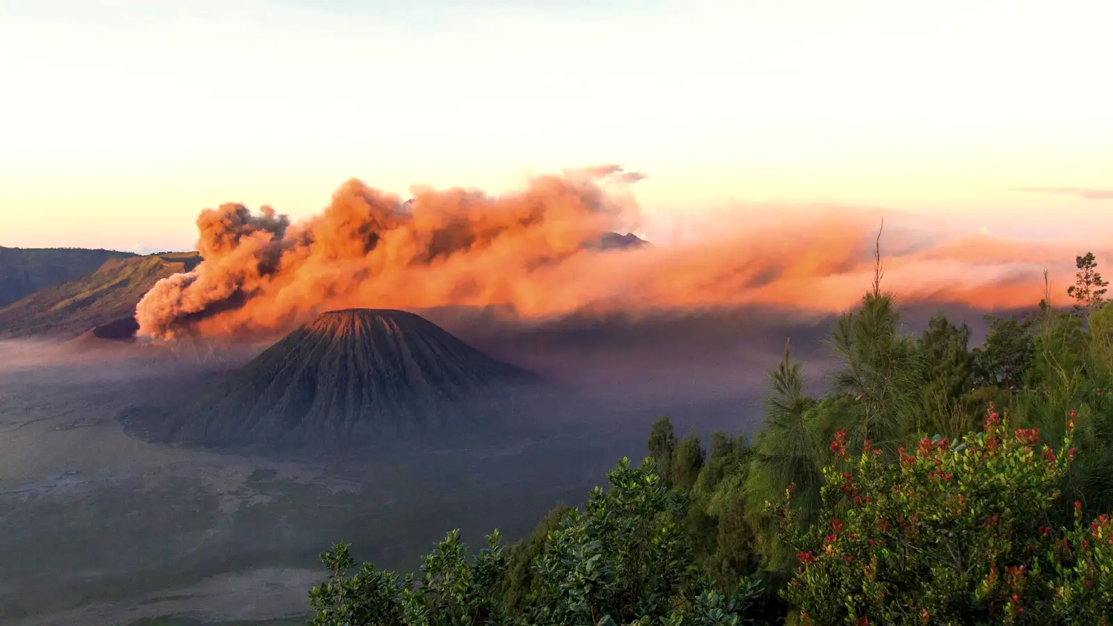 Mount Bromo Crater View The smoking crater of Mount Bromo seen from a distance during the golden hour