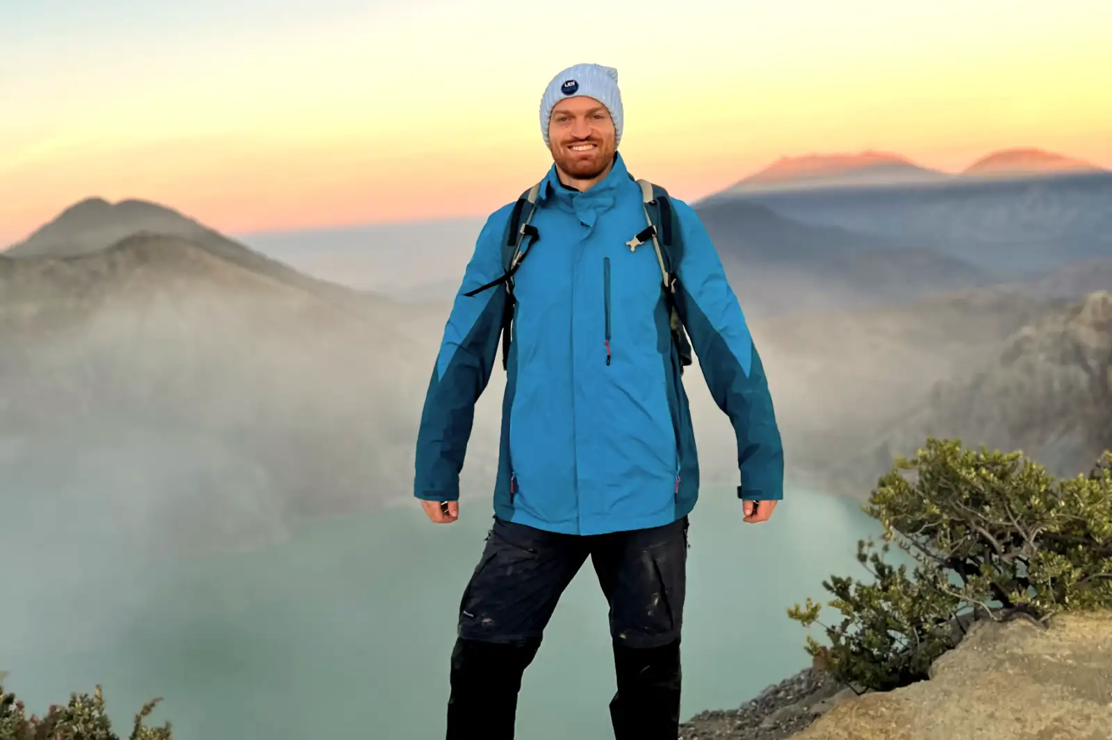 Ijen Crater Morning View Sunrise over the turquoise acidic lake of Ijen Crater